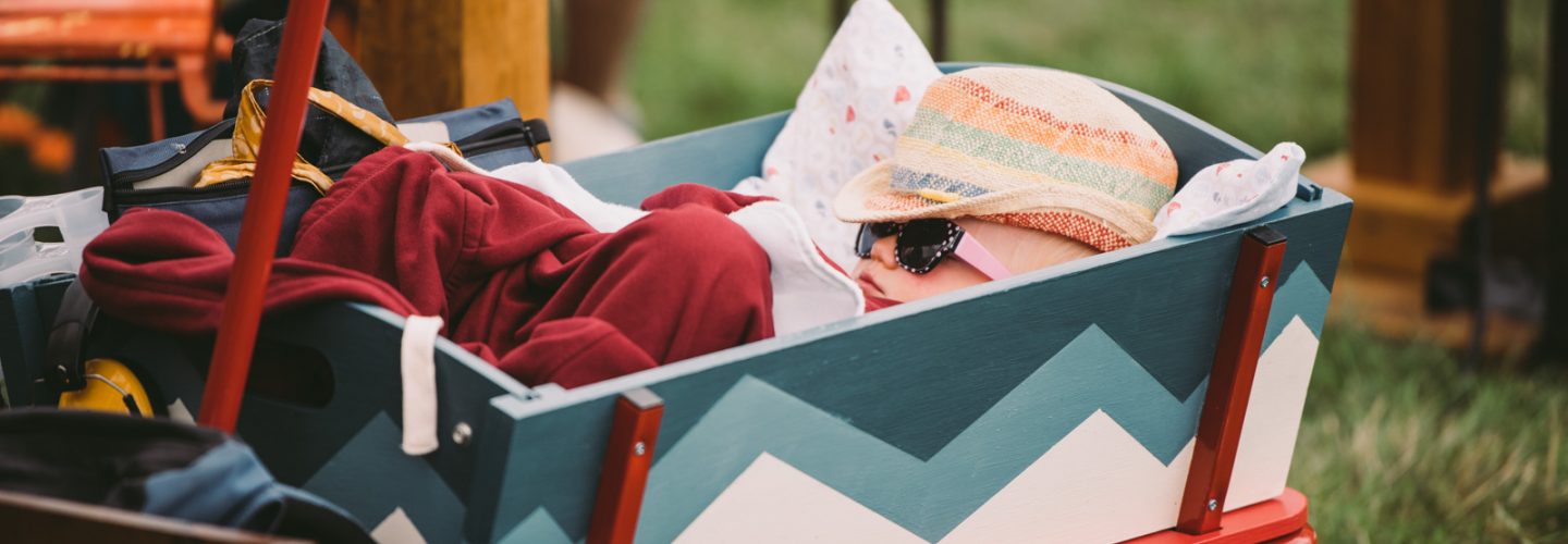 Child napping in pull along wagon