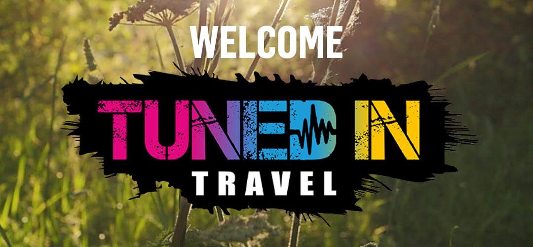 tuned in travel logo